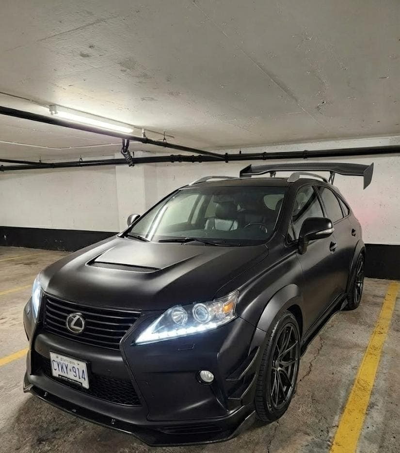 Matte black modified Lexus RX with body kit and spoiler